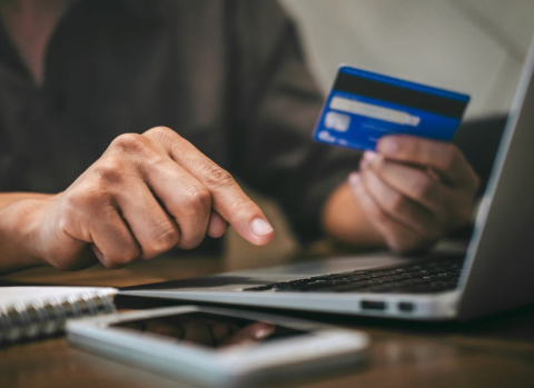 person holding credit card